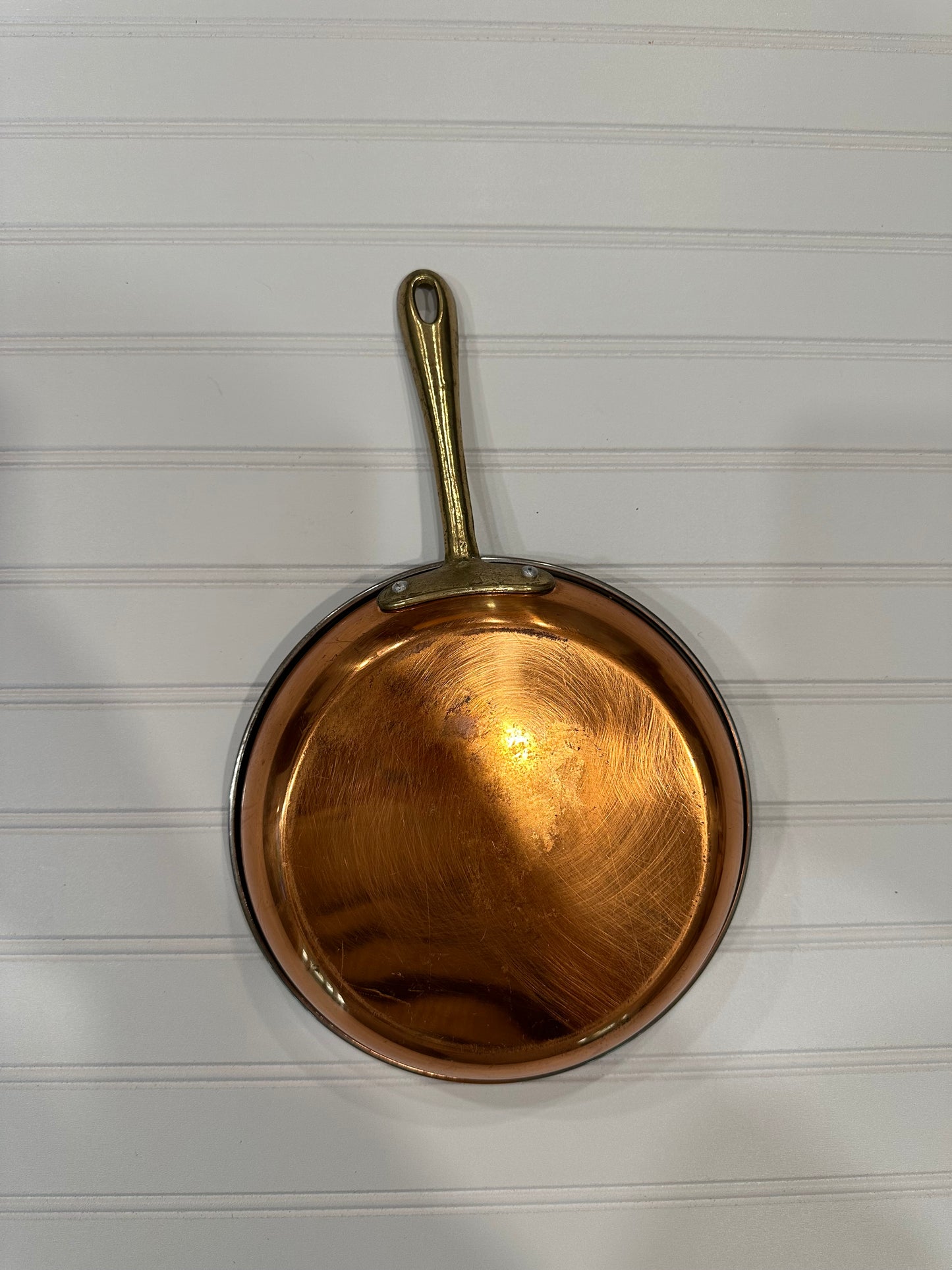 Copper pan with brass handle