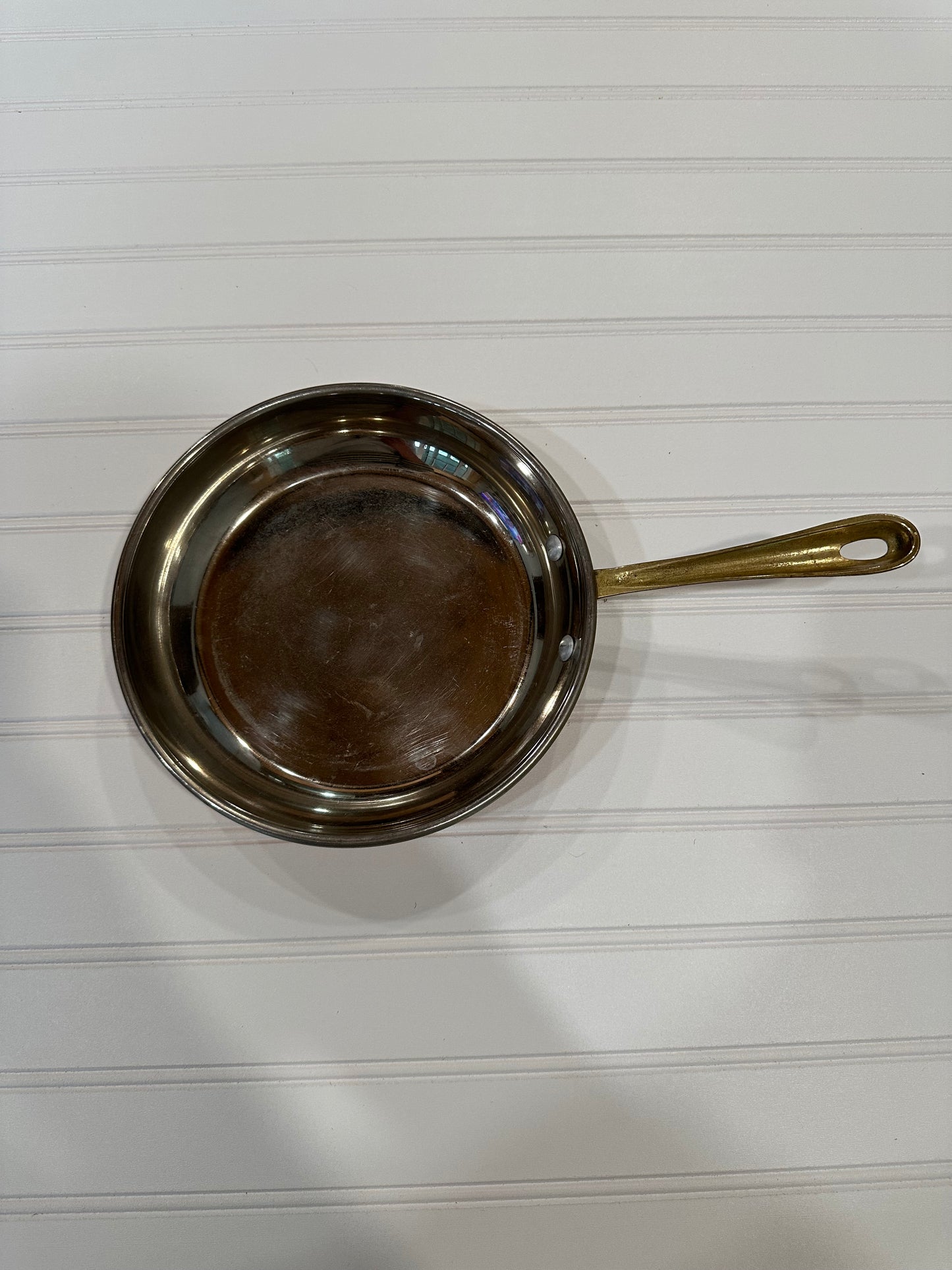 Copper pan with brass handle