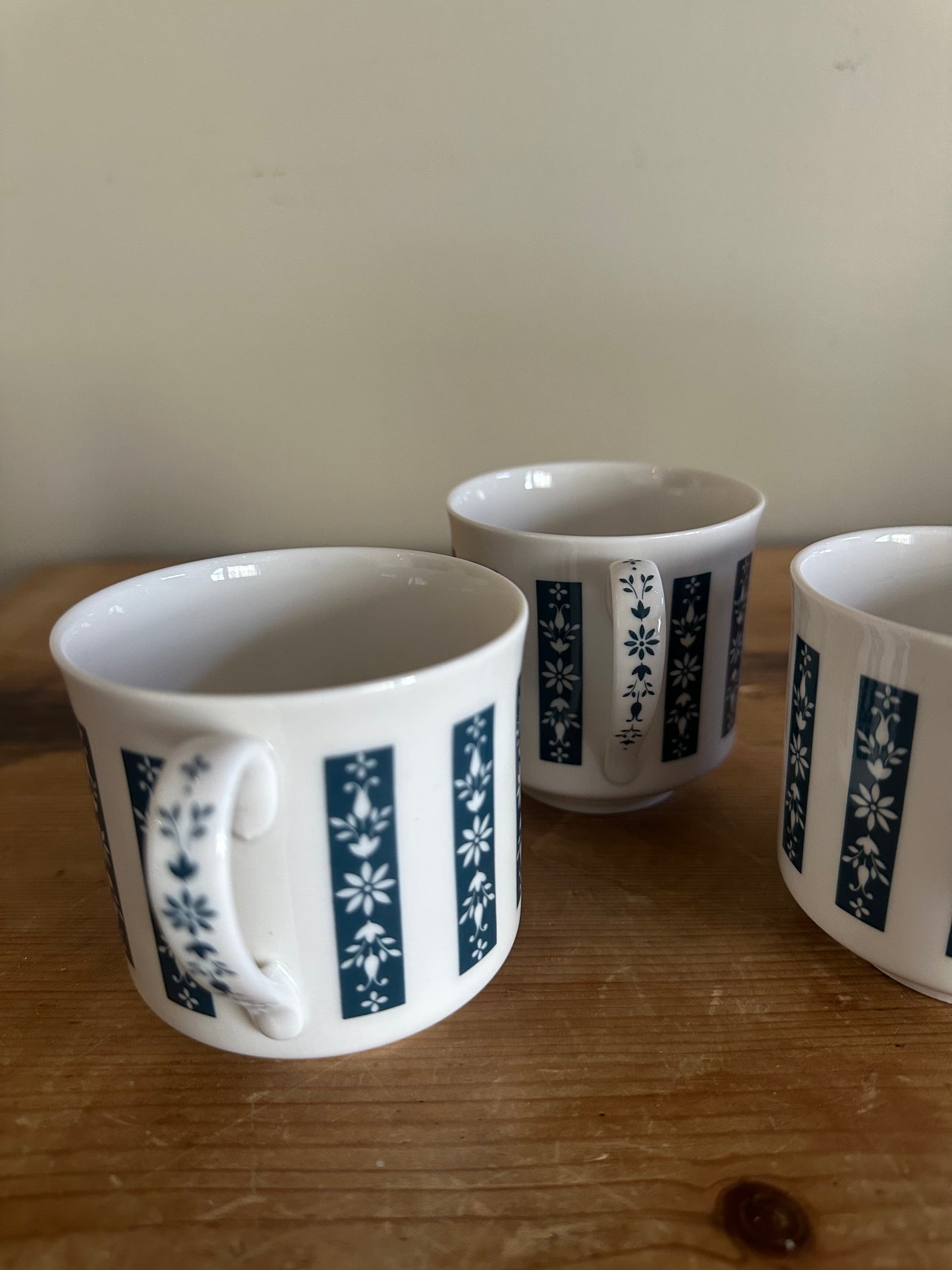 Set of three English moonstone mugs