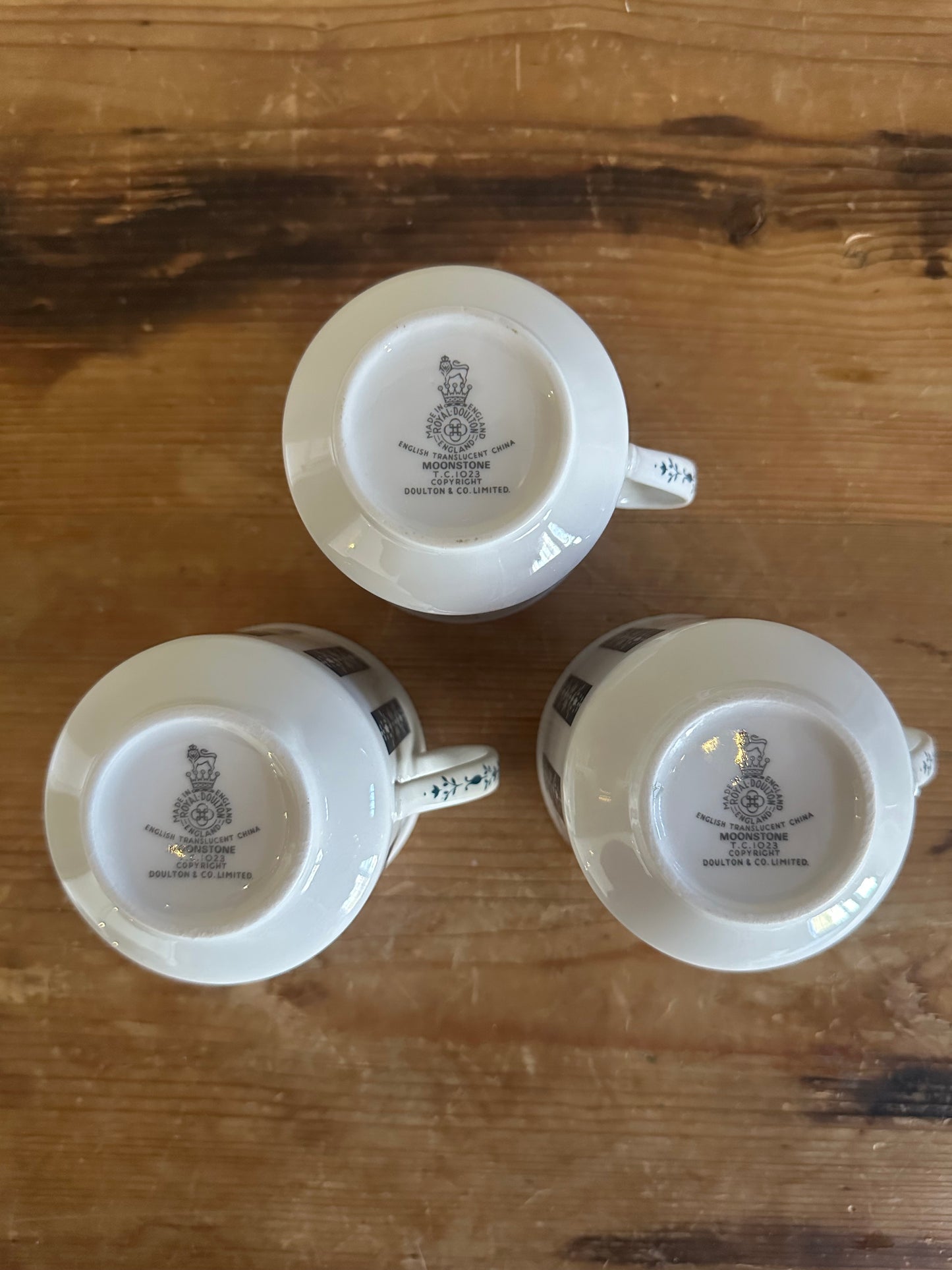 Set of three English moonstone mugs