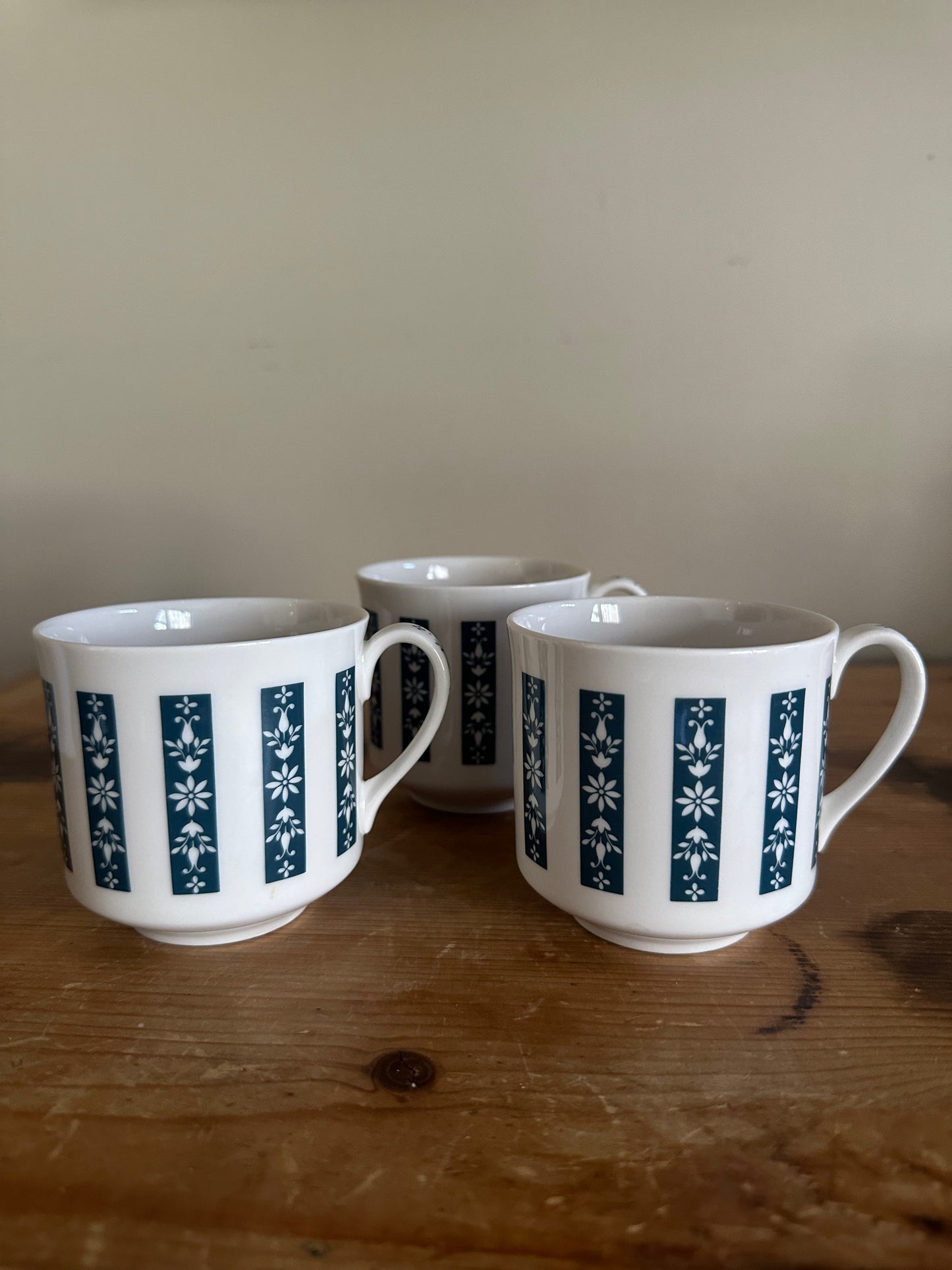 Set of three English moonstone mugs